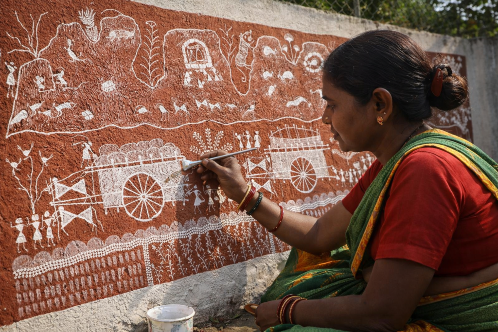 Warli artist at work outdoors